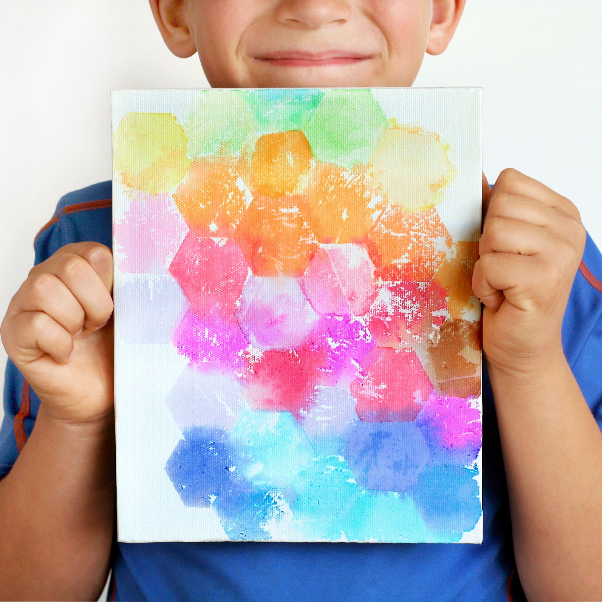 kid painting on canvas